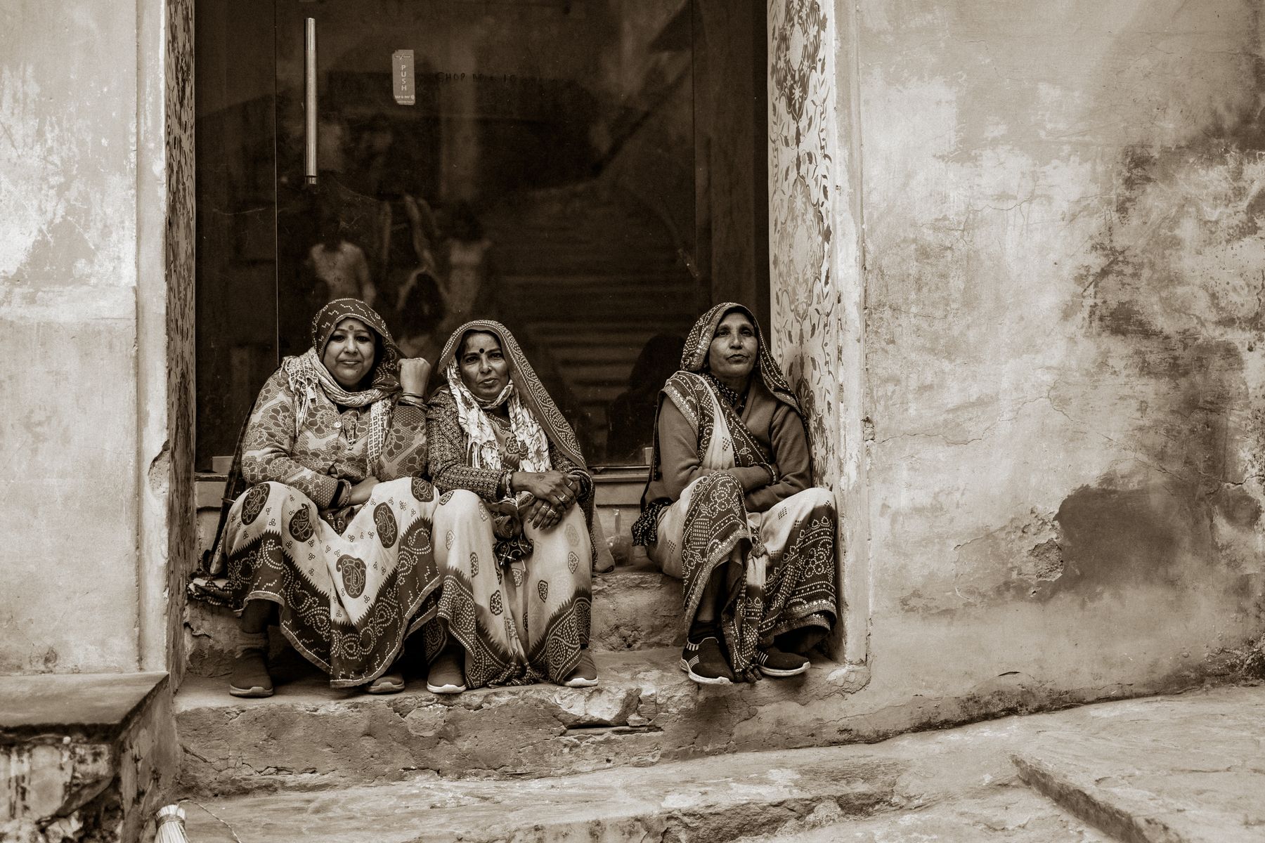 Three Women Seated In Window In Black And White